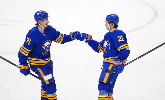 Buffalo Sabres' Jack Quinn (22) celebrates a goal with teammate Ryan McLeod (71) as they take on the Ottawa Senators during first period NHL hockey action in Ottawa on Thursday, Jan. 9, 2025. (Sean Kilpatrick/The Canadian Press via AP)