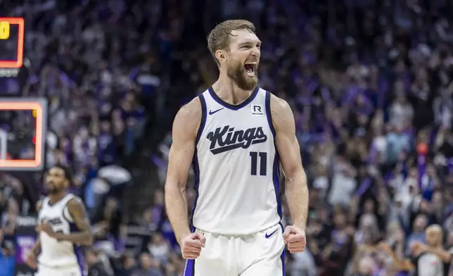 Sacramento Kings center Domantas Sabonis reacts as the time runs out in double overtime of an NBA basketball game against the Miami Heat Monday, Jan. 6, 2025, in Sacramento, Calif. The Kings win 123-118 in double overtime. (AP Photo/Sara Nevis)