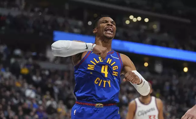 Denver Nuggets guard Russell Westbrook reacts after making a basket against the Los Angeles Clippers in the first half of an NBA basketball game Wednesday, Jan. 8, 2025, in Denver. (AP Photo/David Zalubowski)