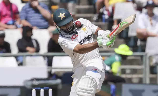 Pakistan's Mohammad Rizwan is struck by the ball off the bowling of South Africa's Marco Jansen during the third day of the second Test match between South Africa and Pakistan in Cape Town, South Africa, Sunday, Jan. 5, 2025. (AP Photo/Halden Krog)