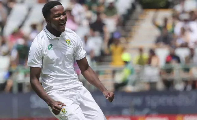 South Africa's Kwena Maphaka celebrates his debut test wicket that of Pakistan's Babar Azam during the third day of the second Test match between South Africa and Pakistan in Cape Town, South Africa, Sunday, Jan. 5, 2025. (AP Photo/Halden Krog)