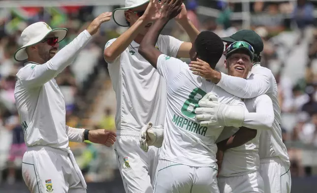 South Africa celebrate the wicket of Pakistan's Babar Azam during the third day of the second Test match between South Africa and Pakistan in Cape Town, South Africa, Sunday, Jan. 5, 2025. (AP Photo/Halden Krog)