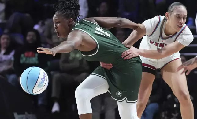Vinyl's Dearica Hamby, right, fouls Rose's Chelsea Gray, left, during an Unrivaled 3-on-3 basketball game Friday, Jan. 17, 2025, in Medley, Fla. (AP Photo/Marta Lavandier)