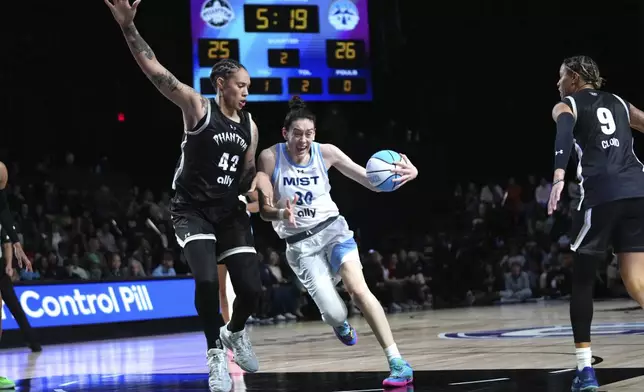 Phantom center Brittney Griner (42) defends against Mist forward Breanna Stewart (30) during the first half of an Unrivaled 3-on-3 basketball game Friday, Jan. 24, 2025, in Medley, Fla. (AP Photo/Lynne Sladky)