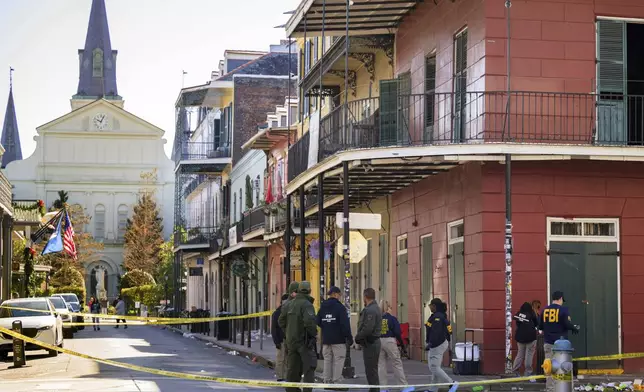 FILE - The FBI investigates the area on Orleans Street and Bourbon Street by St. Louis Cathedral in the French Quarter where a suspicious package was detonated after a person drove a truck into a crowd earlier on Bourbon Street on Wednesday, Jan. 1, 2025. (AP Photo/Matthew Hinton, File)