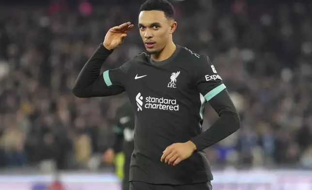 Liverpool's Trent Alexander-Arnold celebrates after scoring his side's fourth goal during the English Premier League soccer match between West Ham United and Liverpool at the London Stadium in London, Sunday, Dec. 29, 2024. (AP Photo/Kirsty Wigglesworth)