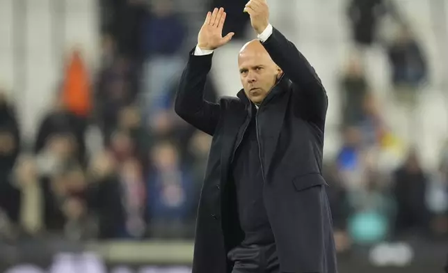 Liverpool's manager Arne Slot celebrates after their win in the English Premier League soccer match against West Ham United at the London Stadium in London, Sunday, Dec. 29, 2024. (AP Photo/Kirsty Wigglesworth)