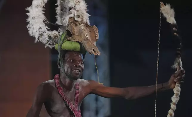 A voodoo worshipper performs during the annual Voodoo Festival in Ouidah, Benin, Friday, Jan. 10, 2025. (AP Photo/Sunday Alamba)