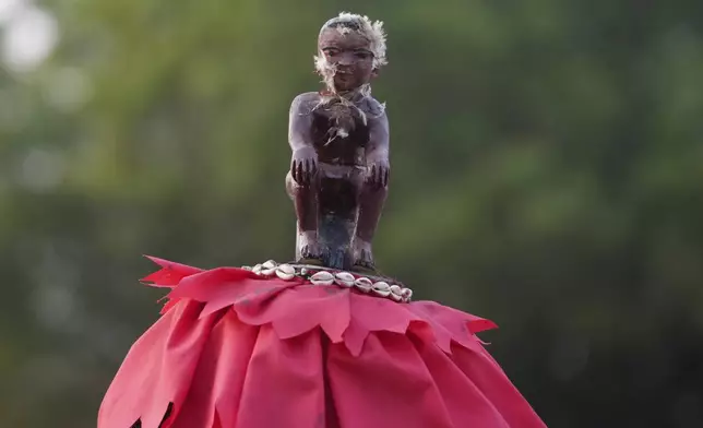 Zangbeto masquerades the traditional Voodoo guardians of the night performing ahead of the annual Voodoo Festival in Ouidah, Benin, Thursday, Jan. 9, 2025. (AP Photo/Sunday Alamba)