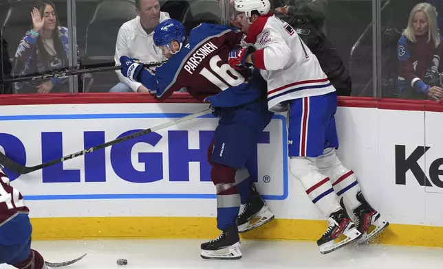 Montreal Canadiens defenseman Arber Xhekaj, right, checks Colorado Avalanche center Juuso Parssinen as they pursue the puck in the second period of an NHL hockey game Saturday, Jan. 4, 2025, in Denver. (AP Photo/David Zalubowski)