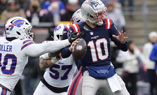 New England Patriots quarterback Drake Maye (10) is pressured by Buffalo Bills linebacker Von Miller (40) during the first half of an NFL football game, Sunday, Jan. 5, 2025, in Foxborough, Mass. (AP Photo/Robert F. Bukaty)