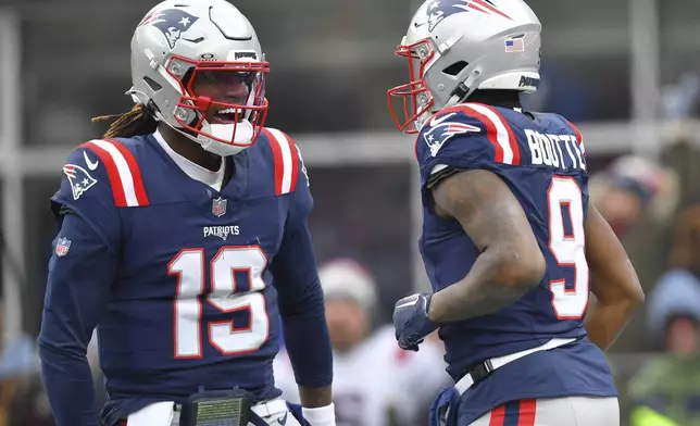 New England Patriots wide receiver Kayshon Boutte (9) is congratulated by Patriots quarterback Joe Milton III (19) after his touchdown agains the Buffalo Billsduring the first half of an NFL football game, Sunday, Jan. 5, 2025, in Foxborough, Mass. (AP Photo/Steven Senne)