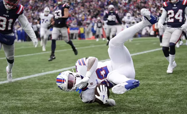 Buffalo Bills running back Ray Davis (22) beats New England Patriots defenders and drops into the end zone for a touchdown during the first half of an NFL football game, Sunday, Jan. 5, 2025, in Foxborough, Mass. (AP Photo/Robert F. Bukaty)