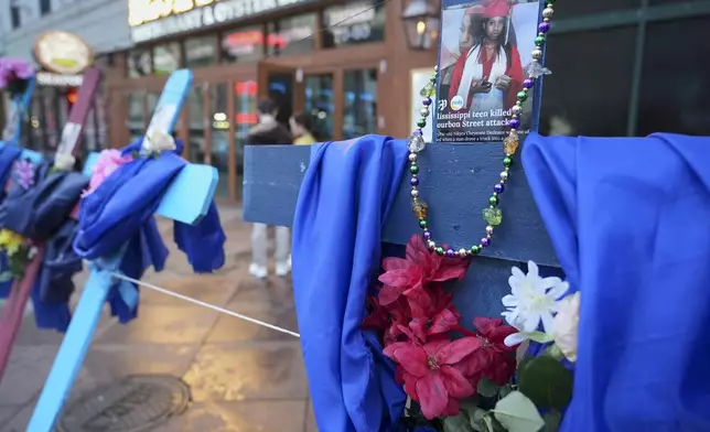 A memorial to the victims of a deadly truck attack is seen on Canal Street in the French Quarter, Friday, Jan. 3, 2025, in New Orleans. (AP Photo/George Walker IV)