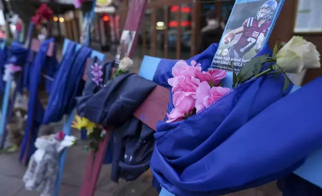 A memorial to the victims of a deadly truck attack is seen on Canal Street in the French Quarter, Friday, Jan. 3, 2025, in New Orleans. (AP Photo/George Walker IV)