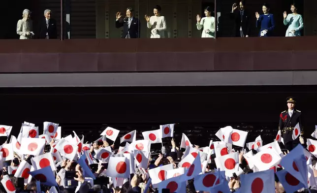 Japan's Empress Emerita Michiko, from left, Emperor Emeritus Akihito, Emperor Naruhito, Empress Masako, Princess Aiko, Crown Prince Akishino, Crown Princess Kiko and Princess Kako wave at well-wishers during a public appearance for New Year celebrations at the Imperial Palace in Tokyo, Thursday, Jan. 2, 2025. (Kim Kyung-Hoon/Pool Photo via AP)