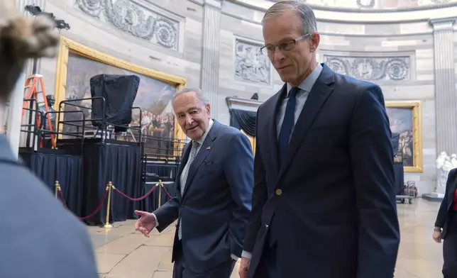 Senate Minority Leader Chuck Schumer, D-N.Y., left, and Senate Majority Leader John Thune, R-S.D., leads a Senate procession through the Rotunda to the House Chamber for a joint session of congress to confirm the Electoral College votes, at the Capitol on Monday, Jan. 6, 2025, in Washington. Walking behind her is Sen. Chuck Grassley R-Iowa. (AP Photo/Jose Luis Magana)