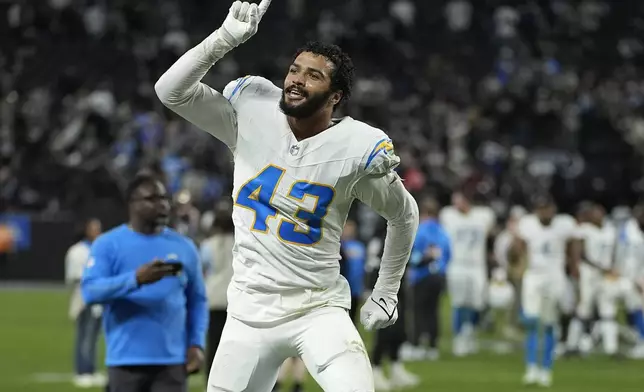 Los Angeles Chargers linebacker Troy Dye (43) celebrates after an NFL football game against the Las Vegas Raiders in Las Vegas, Sunday, Jan. 5, 2025. (AP Photo/John Locher)