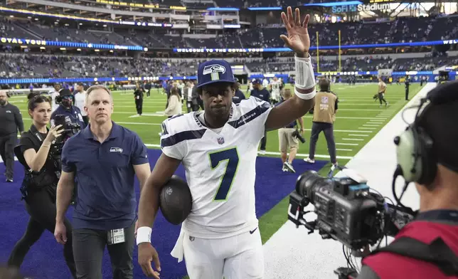 Seattle Seahawks quarterback Geno Smith (7) walks off the field after a win over the Los Angeles Rams in an NFL football game Sunday, Jan. 5, 2025, in Inglewood, Calif. (AP Photo/Eric Thayer)