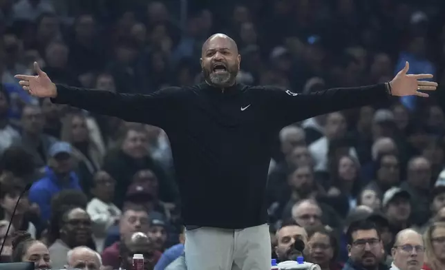 Detroit Pistons head coach J.B. Bickerstaff gestures in the first half of an NBA basketball game against the Cleveland Cavaliers, Monday, Jan. 27, 2025, in Cleveland. (AP Photo/Sue Ogrocki)