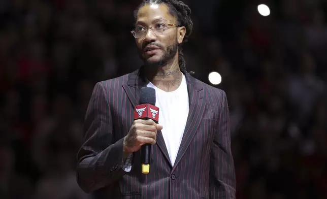 Former NBA player Derrick Rose speaks to the crowd during a half-time ceremony during an NBA basketball game between the New York Knicks and the Chicago Bulls, Saturday, Jan. 4, 2025, in Chicago. (AP Photo/Melissa Tamez)