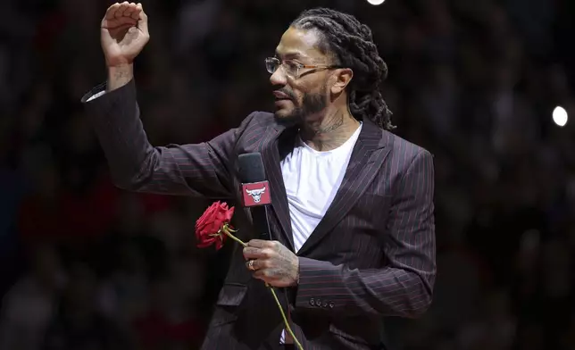 Former NBA player Derrick Rose speaks to the crowd during a half-time ceremony during an NBA basketball game between the New York Knicks and the Chicago Bulls, Saturday, Jan. 4, 2025, in Chicago. (AP Photo/Melissa Tamez)