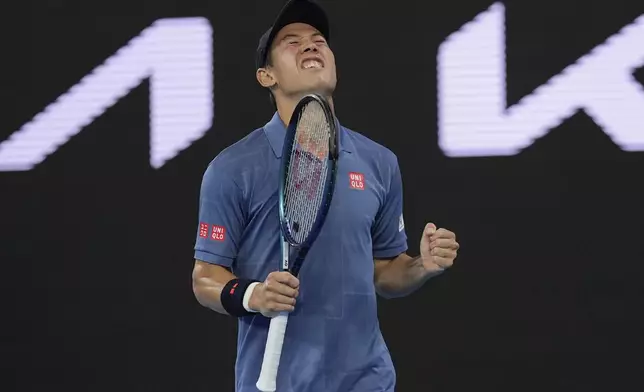 Kei Nishikori of Japan reacts after defeating Thiago Monteiro of Brazil during their first round match at the Australian Open tennis championship in Melbourne, Australia, Sunday, Jan. 12, 2025. (AP Photo/Ng Han Guan)