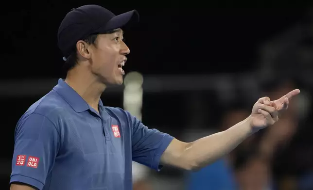 Kei Nishikori of Japan gestures during his first round match against Thiago Monteiro of Brazil at the Australian Open tennis championship in Melbourne, Australia, Sunday, Jan. 12, 2025. (AP Photo/Ng Han Guan)