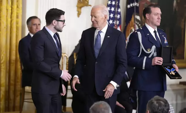 President Joe Biden, center, presents the Presidential Medal of Freedom, the Nation's highest civilian honor, to Alex Soros, left, on behalf of his father George Soros, in the East Room of the White House, Saturday, Jan. 4, 2025, in Washington. (AP Photo/Manuel Balce Ceneta)