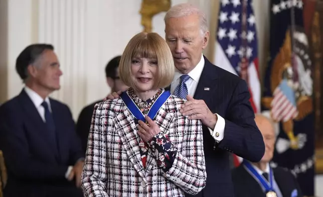 President Joe Biden, right, presents the Presidential Medal of Freedom, the Nation's highest civilian honor, to Anna Wintour in the East Room of the White House, Saturday, Jan. 4, 2025, in Washington. (AP Photo/Manuel Balce Ceneta)