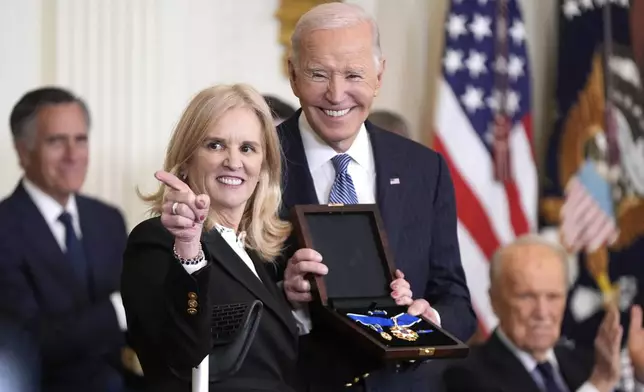 President Joe Biden, right, posthumously presents the Presidential Medal of Freedom, the Nation's highest civilian honor, to Kerry Kennedy on behalf of her late father Robert F. Kennedy in the East Room of the White House, Saturday, Jan. 4, 2025, in Washington. (AP Photo/Manuel Balce Ceneta)