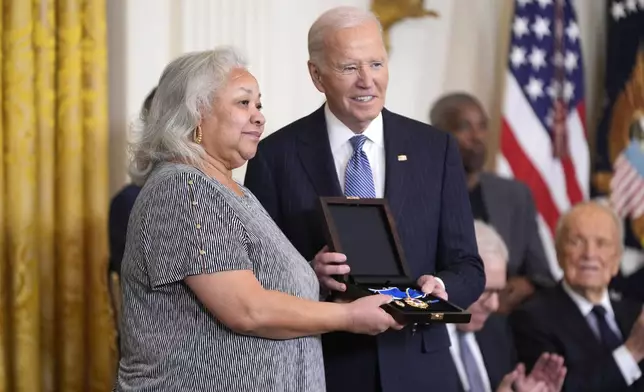 President Joe Biden, right, posthumously presents the Presidential Medal of Freedom, the Nation's highest civilian honor, to Doris Hamer Richardson on behalf of her late aunt Fannie Lou Hamer in the East Room of the White House, Saturday, Jan. 4, 2025, in Washington. (AP Photo/Manuel Balce Ceneta)