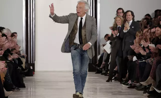 FILE - Designer Ralph Lauren acknowledges audience applause after his Fall 2016 collection was modeled during Fashion Week in New York, Feb. 18, 2016. (AP Photo/Richard Drew, File)