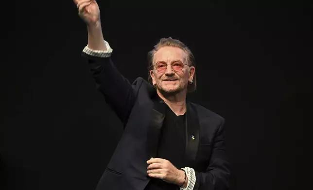 FILE - U2's Bono performs onstage during the stage presentation of the film "Kiss the Future" at Verti Music Hall, in Berlin, Germany, Sunday, Feb. 19, 2023. The 73rd Berlin International Film Festival runs until Feb. 26. (Jens Kalaene/dpa via AP, File)