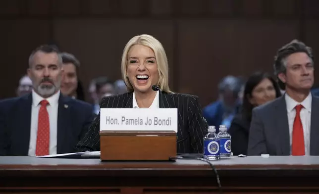 Pam Bondi, President-elect Donald Trump's choice to lead the Justice Department as attorney general, appears before the Senate Judiciary Committee for her confirmation hearing, at the Capitol in Washington, Wednesday, Jan. 15, 2025. (AP Photo/Ben Curtis)