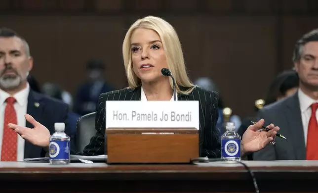 Pam Bondi, President-elect Donald Trump's choice to lead the Justice Department as attorney general, appears before the Senate Judiciary Committee for her confirmation hearing, at the Capitol in Washington, Wednesday, Jan. 15, 2025. (AP Photo/Ben Curtis)