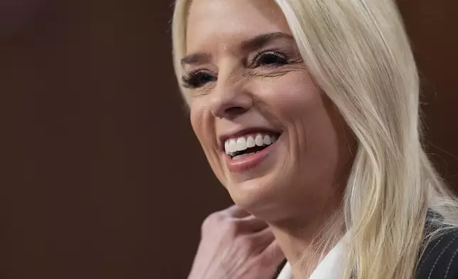 Pam Bondi, President-elect Donald Trump's choice to lead the Justice Department as attorney general, appears before the Senate Judiciary Committee for her confirmation hearing, at the Capitol in Washington, Wednesday, Jan. 15, 2025. (AP Photo/Ben Curtis)