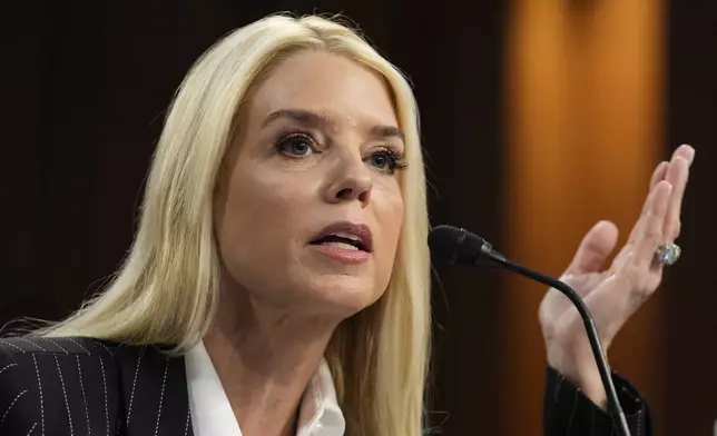 Pam Bondi, President-elect Donald Trump's choice to lead the Justice Department as attorney general, appears before the Senate Judiciary Committee for her confirmation hearing, at the Capitol in Washington, Wednesday, Jan. 15, 2025. (AP Photo/J. Scott Applewhite)