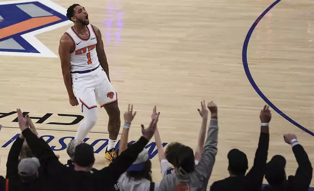 New York Knicks' Cameron Payne (1) celebrates with fans after a 3-point basket during the first half of an NBA basketball game against the Atlanta Hawks, Monday, Jan. 20, 2025, in New York. (AP Photo/Heather Khalifa)