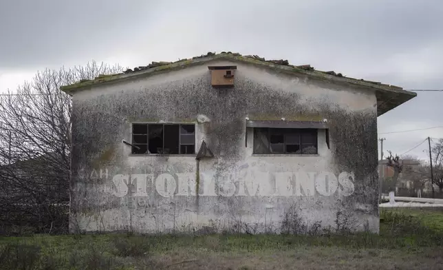 A wooden nest for barn owls is placed at the top of an abandoned storage at the village of Modesto, near Larissa , central Greece, on Jan. 22, 2025. (AP Photo/Petros Giannakouris)