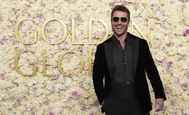 Glen Powell arrives at the 82nd Golden Globes on Sunday, Jan. 5, 2025, at the Beverly Hilton in Beverly Hills, Calif. (Photo by Jordan Strauss/Invision/AP)