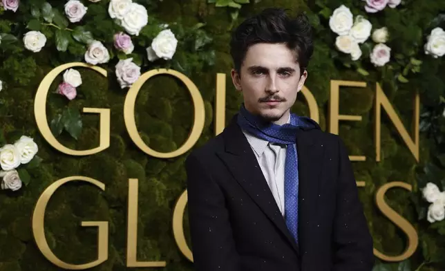 Timothee Chalamet arrives at the 82nd Golden Globes on Sunday, Jan. 5, 2025, at the Beverly Hilton in Beverly Hills, Calif. (Photo by Jordan Strauss/Invision/AP)