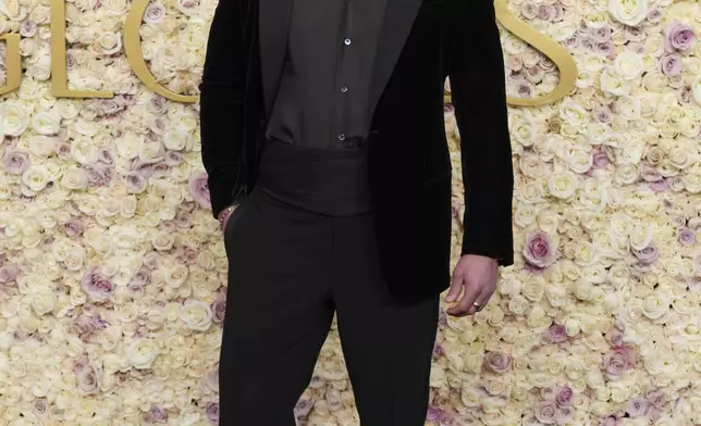 Glen Powell arrives at the 82nd Golden Globes on Sunday, Jan. 5, 2025, at the Beverly Hilton in Beverly Hills, Calif. (Photo by Jordan Strauss/Invision/AP)