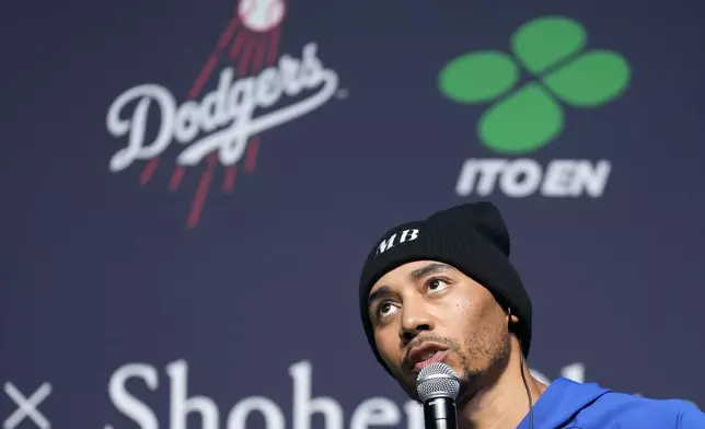 Los Angeles Dodgers right fielder Mookie Betts speaks during a sponsor's promotional event in Tokyo, Tuesday, Jan. 21, 2025. (AP Photo/Eugene Hoshiko)