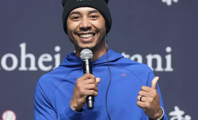 Los Angeles Dodgers right fielder Mookie Betts speaks during a sponsor's promotional event in Tokyo, Tuesday, Jan. 21, 2025. (AP Photo/Eugene Hoshiko)