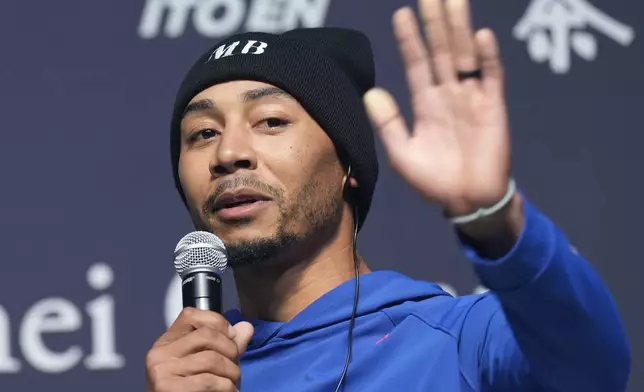 Los Angeles Dodgers right fielder Mookie Betts speaks during a sponsor's promotional event in Tokyo, Tuesday, Jan. 21, 2025. (AP Photo/Eugene Hoshiko)