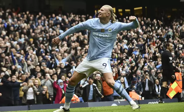 FILE -Manchester City's Erling Haaland celebrates with after scoring his side's second goal during the English Premier League soccer match between Manchester City and and Everton, at the Etihad stadium in Manchester, England, Feb. 10, 2024. (AP Photo/Rui Viera, File)