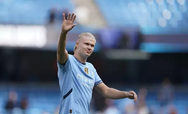FILE -Manchester City's Erling Haaland waves fans after the English Premier League soccer match between Manchester City and Ipswich Town at the Etihad Stadium in Manchester, England, Aug. 24, 2024. (AP Photo/Dave Thompson, File)