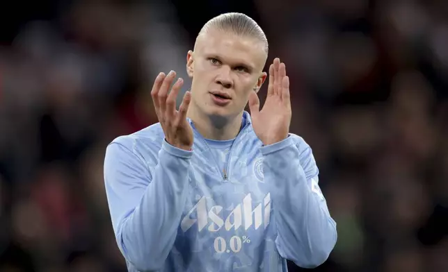 FILE -Manchester City's Erling Haaland claps his hands during warmup before the English Premier League soccer match between Liverpool and Manchester City at Anfield Stadium, Liverpool, England, Dec. 1, 2024. (AP Photo/Ian Hodgson, File)