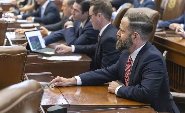 Texas state Rep. Dustin Burrows, R-Lubbock, votes for himself for speaker during opening day of the 89th Texas Legislative Session in Austin, Texas, Tuesday, Jan. 14, 2025. (AP Photo/Stephen Spillman)